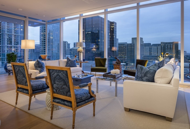 living room featuring expansive windows and wood-type flooring