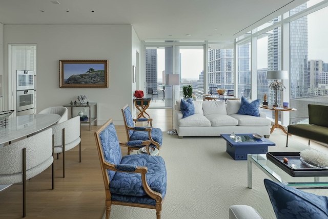 living room with floor to ceiling windows and wood-type flooring