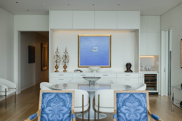 interior space with dark hardwood / wood-style flooring and wine cooler