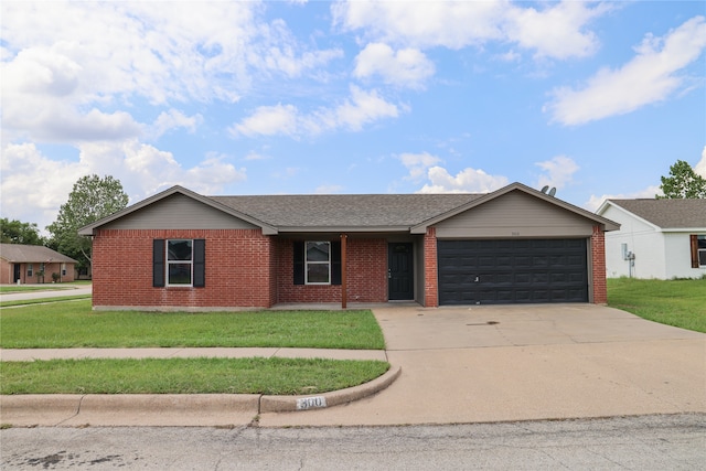 ranch-style home featuring a garage and a front yard