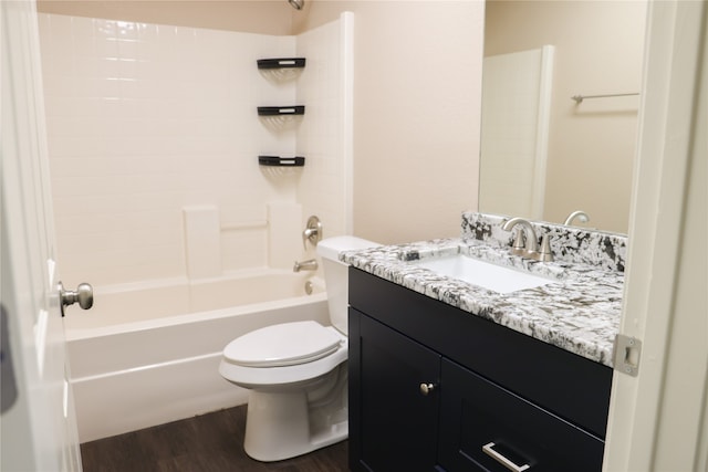 full bathroom featuring vanity, toilet, hardwood / wood-style flooring, and shower / washtub combination