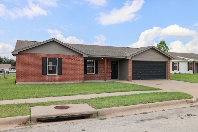 ranch-style home with a front lawn and a garage