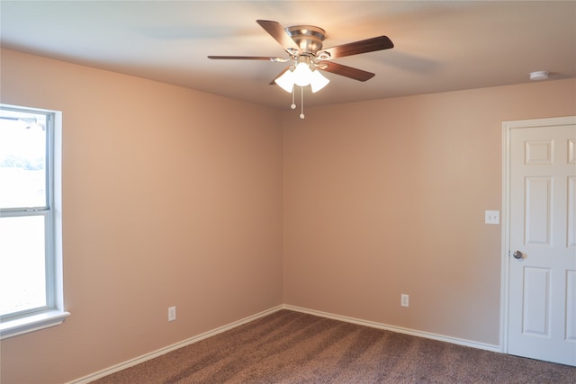 carpeted empty room with ceiling fan