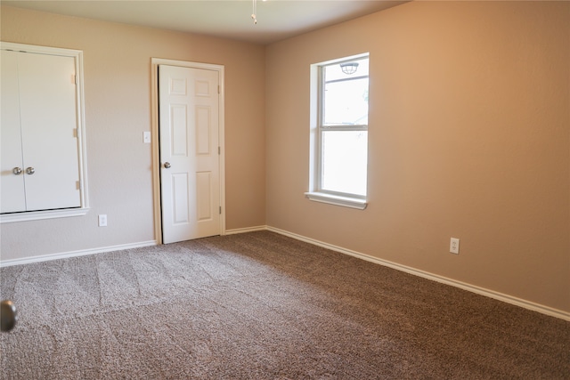 unfurnished room with carpet