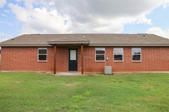 back of house with a yard