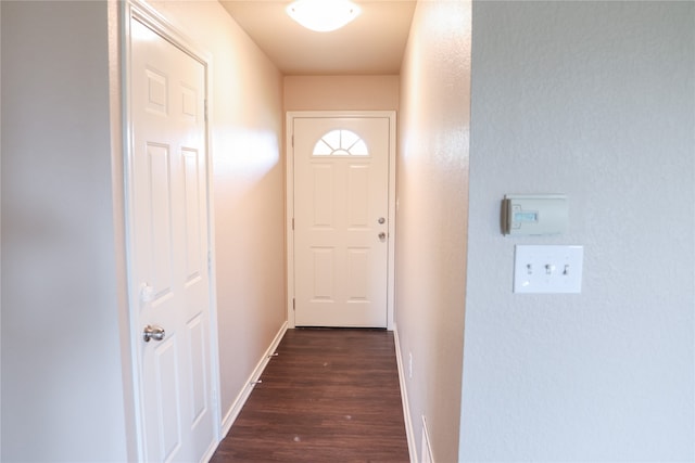 doorway with dark hardwood / wood-style flooring