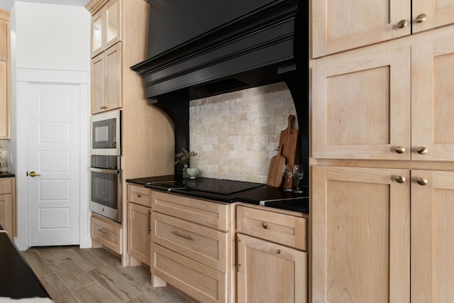 kitchen featuring light hardwood / wood-style floors, light brown cabinets, and tasteful backsplash