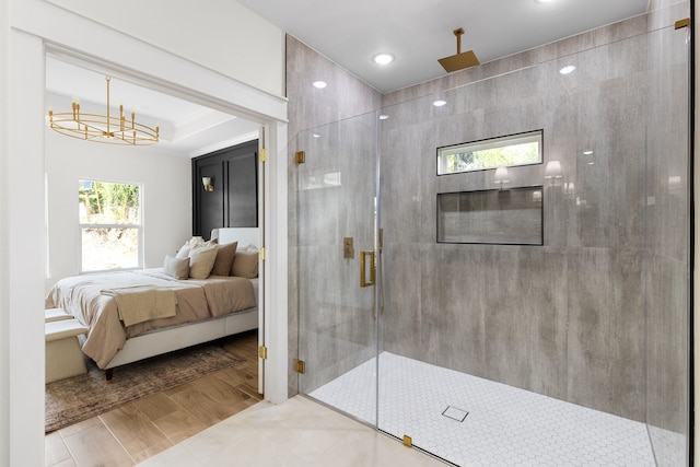 bathroom with tile patterned flooring and a shower with shower door