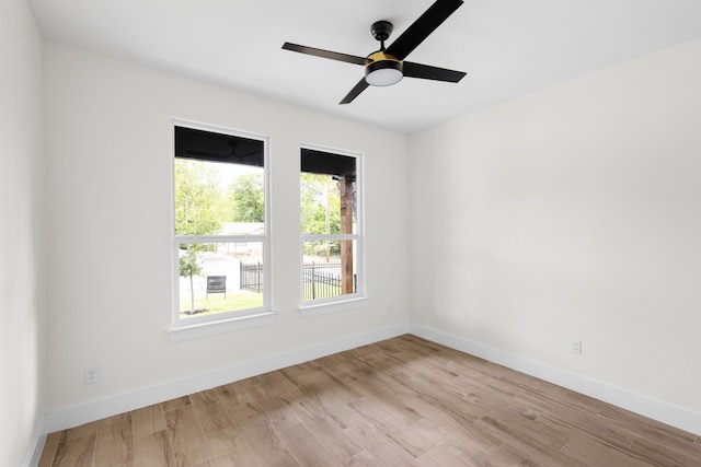 spare room featuring ceiling fan and light hardwood / wood-style floors