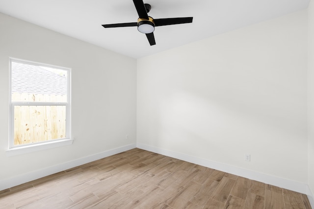 unfurnished room with light hardwood / wood-style flooring and ceiling fan