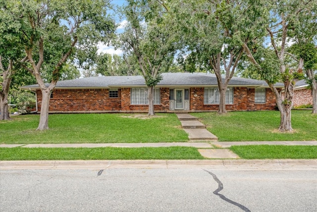 single story home with a front yard