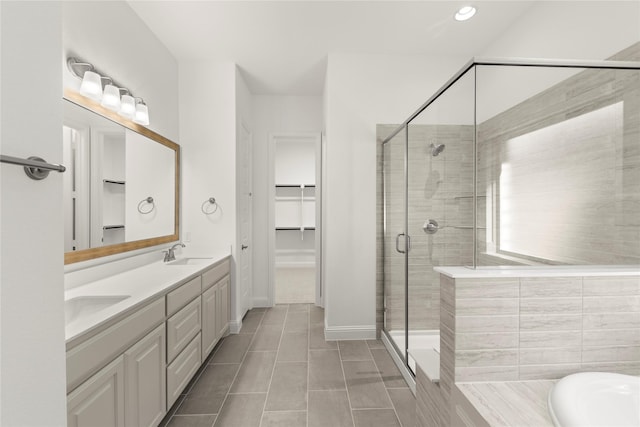 bathroom with vanity, independent shower and bath, and tile patterned flooring