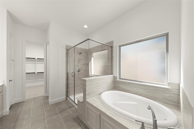 bathroom featuring tile patterned flooring, vanity, and separate shower and tub