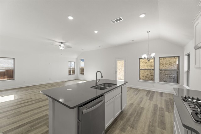 kitchen with a kitchen island with sink, white cabinetry, sink, and stainless steel dishwasher