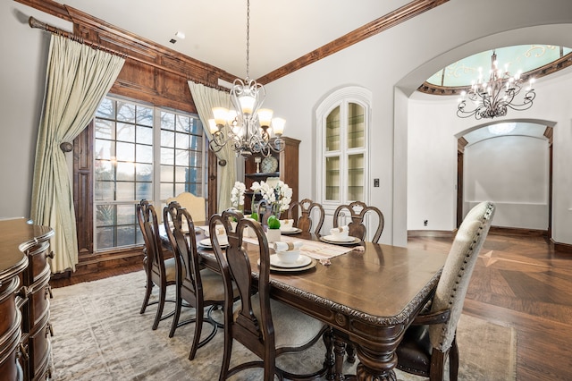 dining room featuring ornamental molding and a notable chandelier