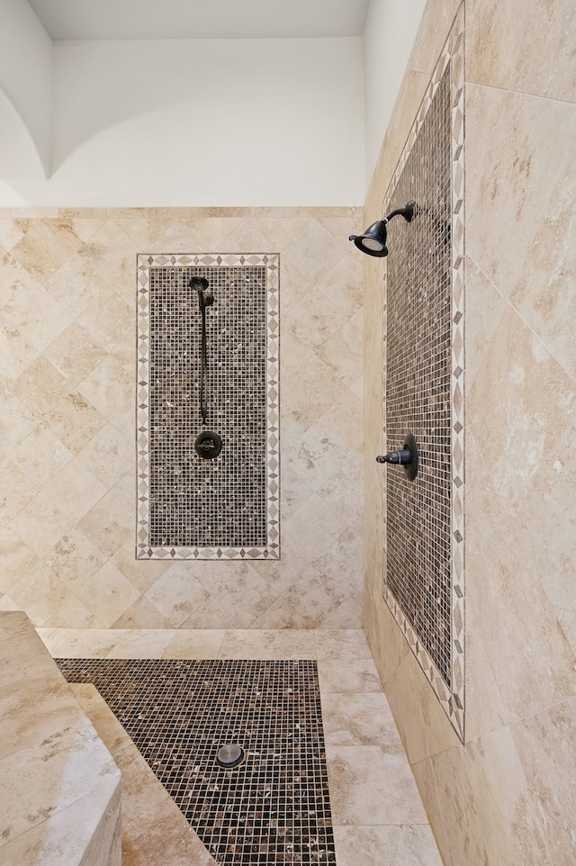 bathroom with tiled shower