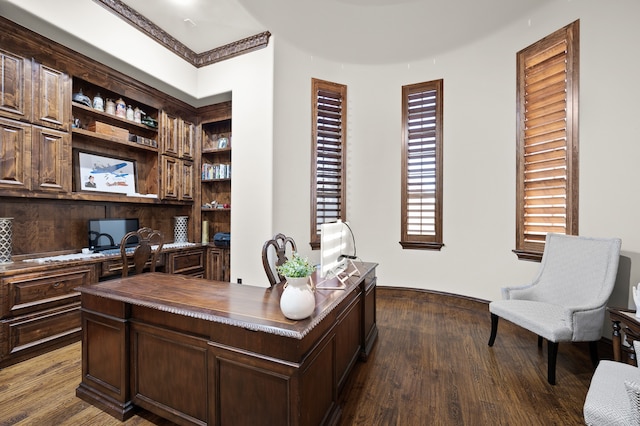 office space featuring hardwood / wood-style flooring and built in shelves