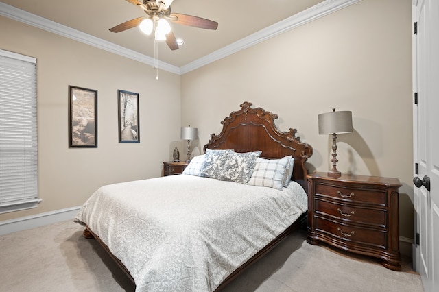 bedroom with ornamental molding, ceiling fan, and carpet floors