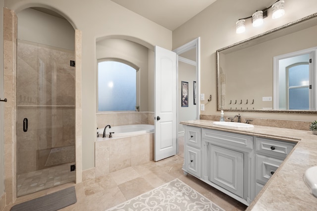 bathroom with vanity, separate shower and tub, and tile patterned floors