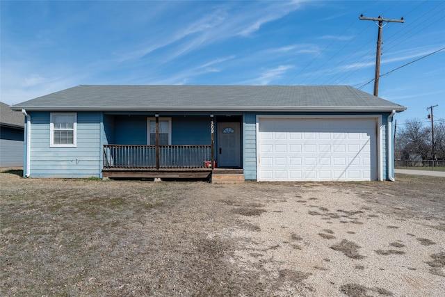 ranch-style house featuring a garage and a porch