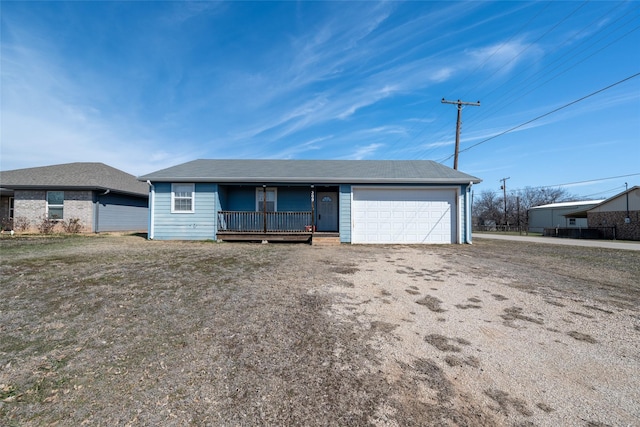 ranch-style home with covered porch and a front yard