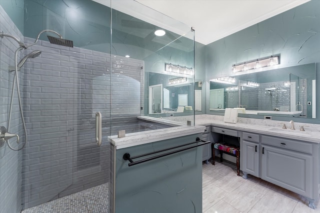 bathroom with ornamental molding, vanity, an enclosed shower, and tile patterned flooring