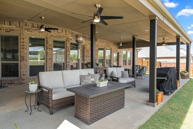 view of patio / terrace featuring grilling area, an outdoor hangout area, and ceiling fan