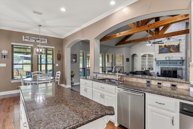 kitchen featuring dishwasher, dark hardwood / wood-style flooring, ceiling fan with notable chandelier, and white cabinetry