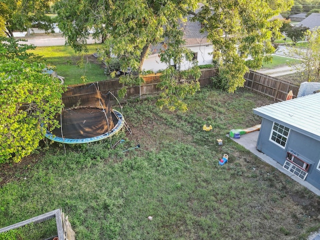 view of yard featuring a trampoline