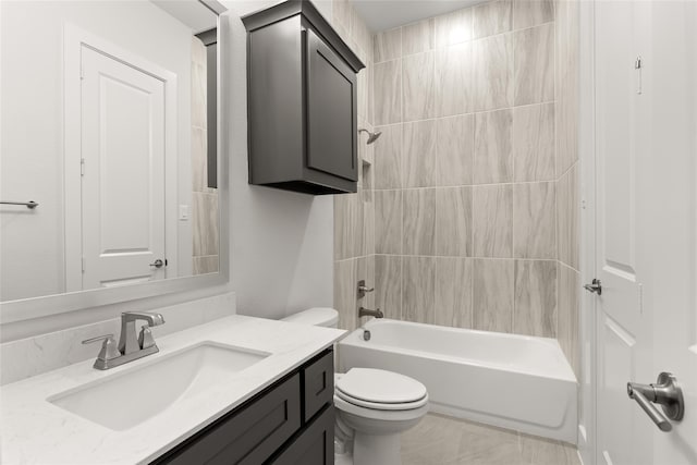 full bathroom featuring toilet, vanity, and tiled shower / bath