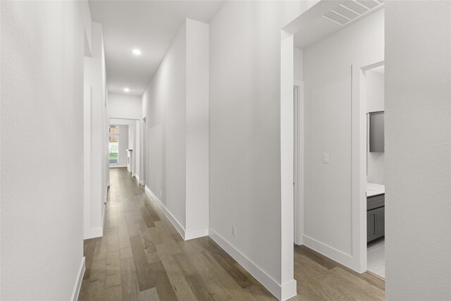 corridor featuring light hardwood / wood-style flooring