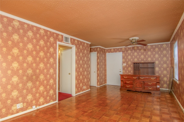 interior space featuring parquet floors, ceiling fan, ornamental molding, and a textured ceiling