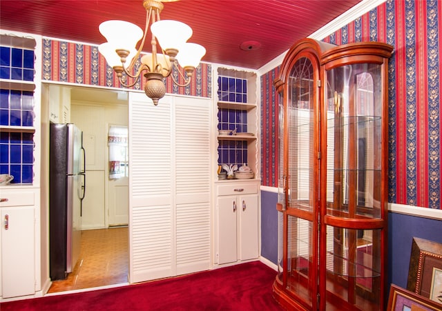 interior space featuring tile patterned flooring and an inviting chandelier