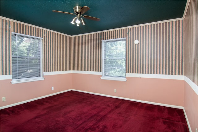 carpeted empty room featuring ceiling fan