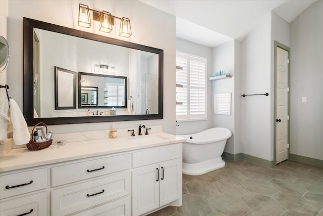 bathroom featuring vanity, tile patterned floors, and a bathing tub