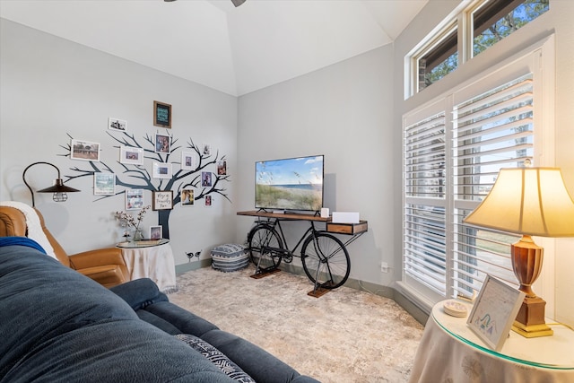 living room featuring carpet flooring and high vaulted ceiling