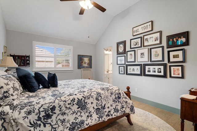 bedroom with ceiling fan, ensuite bathroom, lofted ceiling, and light hardwood / wood-style floors