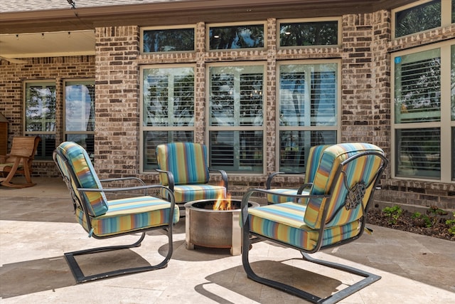 view of patio featuring a fire pit