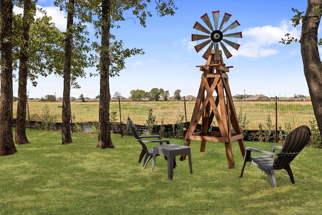 view of yard with a rural view