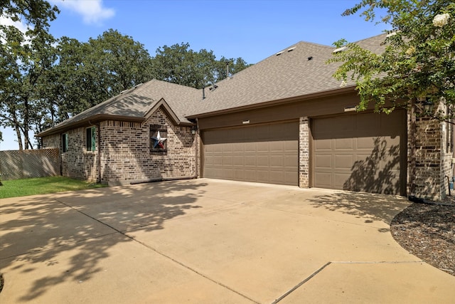 ranch-style home featuring a garage