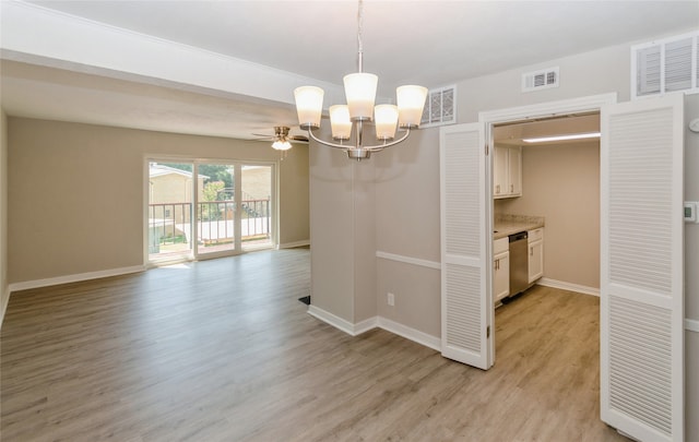 empty room featuring light wood-type flooring and ceiling fan with notable chandelier