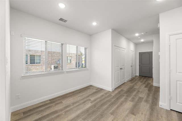 unfurnished room with light hardwood / wood-style flooring