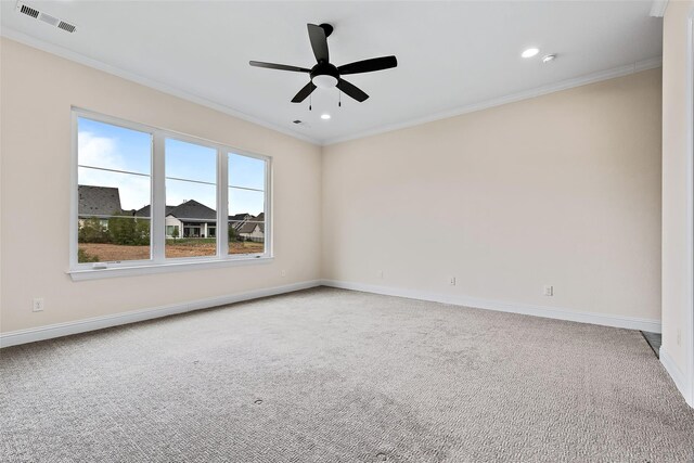 unfurnished room featuring light carpet, baseboards, visible vents, and crown molding