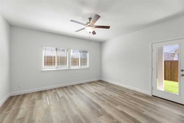 unfurnished room with ceiling fan, plenty of natural light, and light hardwood / wood-style flooring