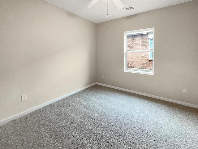 unfurnished room featuring a ceiling fan, carpet, visible vents, and baseboards