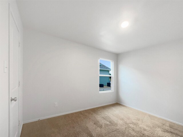 unfurnished room featuring carpet floors