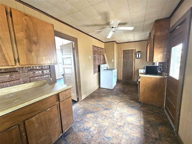 kitchen featuring ceiling fan and gas range gas stove