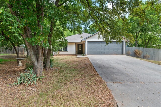 91 Pecan Dr, Pottsboro, TX 75076 - view of front facade with concrete driveway and an attached garage