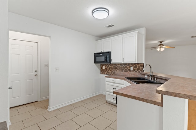 kitchen with backsplash, kitchen peninsula, sink, ceiling fan, and white cabinets