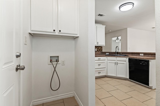 91 Pecan Dr, Pottsboro, TX 75076 - washroom featuring a sink, washer hookup, light tile patterned floors, and baseboards